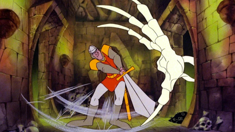 Dirk, a Daring kardot lendít egy nagy csontváz kezére a Sárkányodúban