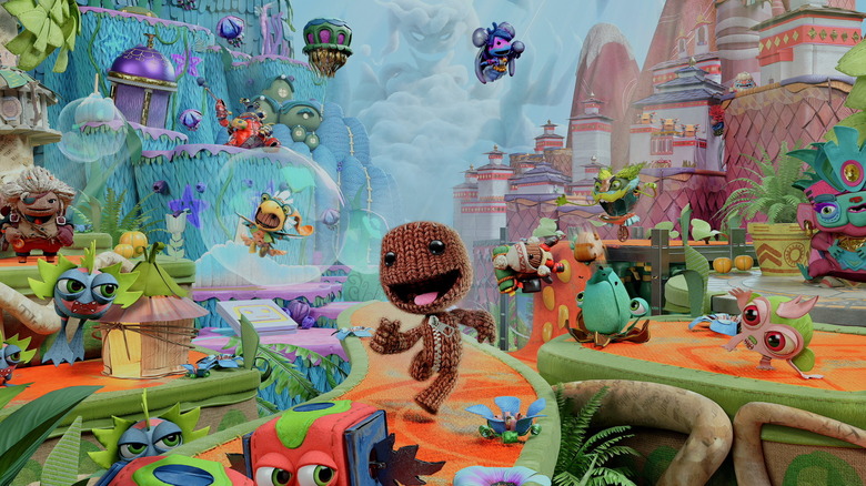 Sackboy boldogan sétál a Craftworldben a Sackboy: A Big Adventure borítóján