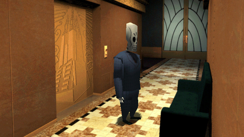 Manny Calavera egy lift mellett áll Grim Fandango egyik folyosóján