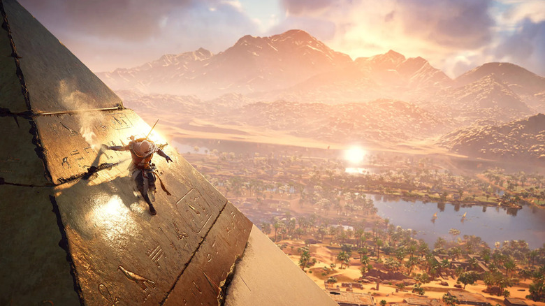 Bayek felmászik egy piramisra, amely a Nílusra néz az Assassin's Creed Originsben