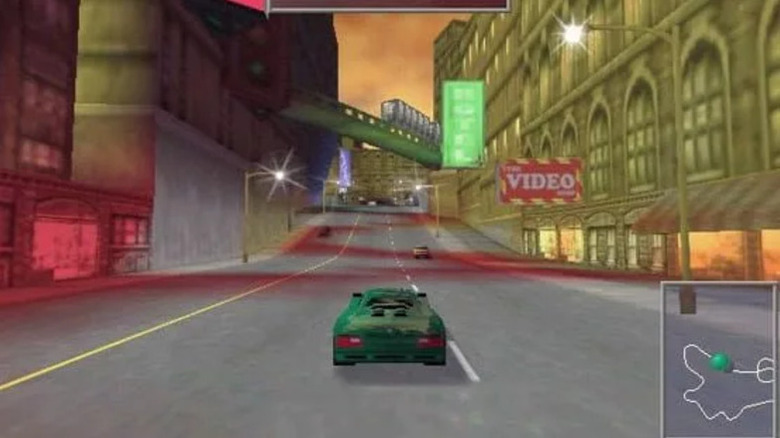 Egy zöld sportautó áthajt egy városon este a Need for Speed ​​III: Hot Pursuit játékban