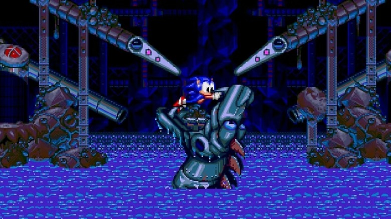 Sonic the Hedgehog egy robotsárkány száját tartja nyitva a Sonic Spinballban