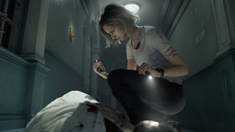 Grace Ashcroft egy test fölött térdel a Resident Evil Requiemben