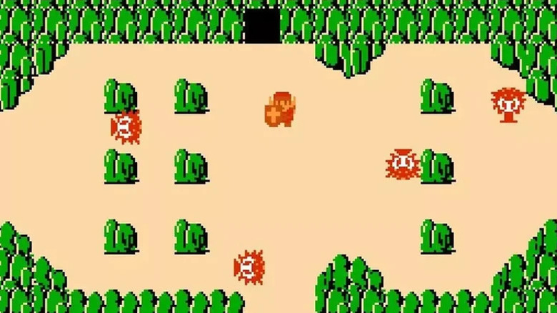 A Link kilép egy sziklákkal és oktarokokkal körülvett barlangból a The Legend of Zelda játékban