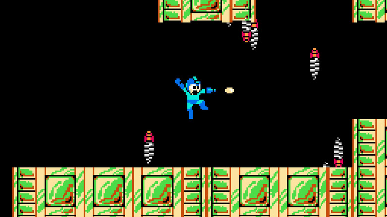 Mega Man ugrik, és elfújja a karját a Mega Man 2-ben