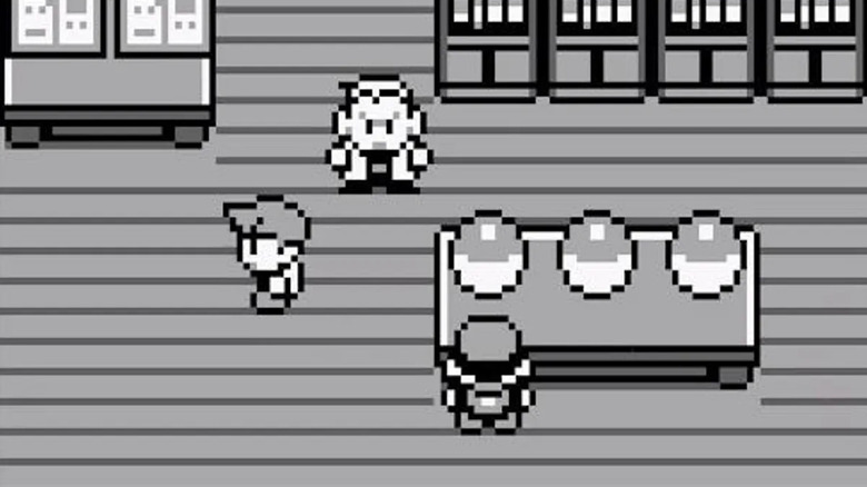 A Pokémon tréner egy asztalhoz közelít három Pokéballal, miközben Oak professzor Pokémon Redben néz
