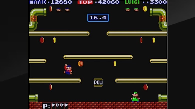 Mario és Luigi érméket ragadnak a Mario Bros platformjain.