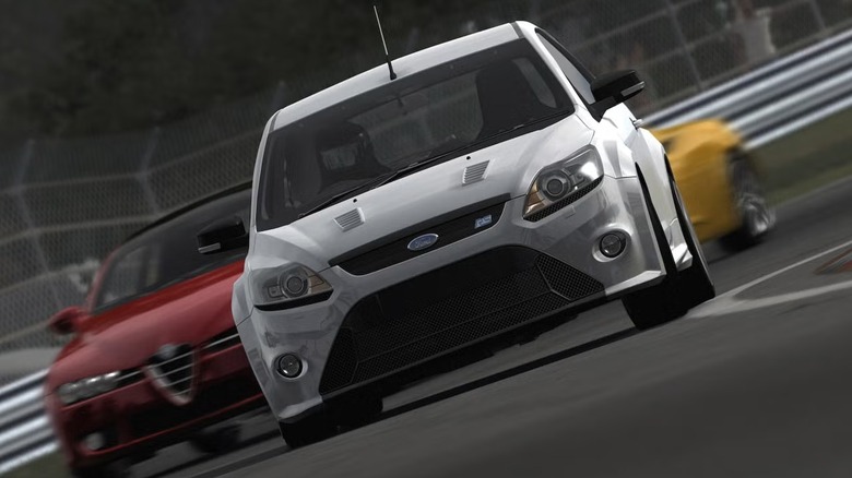 Egy csapat autó száguld egy kanyar körül a Forza Motorsport 3-ban