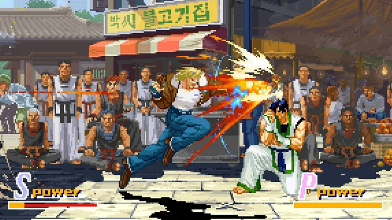 Terry Bogard nekiront egy blokkoló Kim Jae-hoonnak a Garou: A farkasok jele című filmben