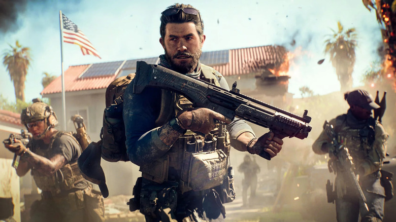Egy katona egy vadászpuskát tart, miközben két osztagtársa a Battlefield 6-ban