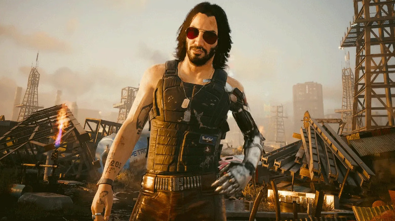Johnny Silverhand beszél V-vel egy roncstelepen a Cyberpunk 2077-ben