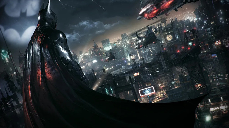 Batman felméri Gotham Cityt az esőben a Batman: Arkham Knightban