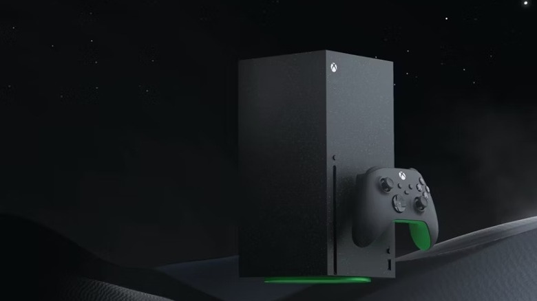 Fekete alapon egy fekete Xbox Series X és egy kontroller ül
