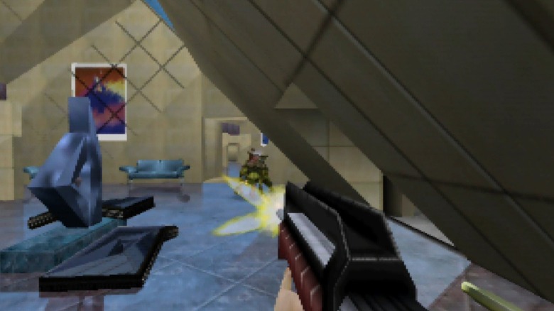 Joanna Dark egy géppuskával lő egy Skedarra a Perfect Dark-ban