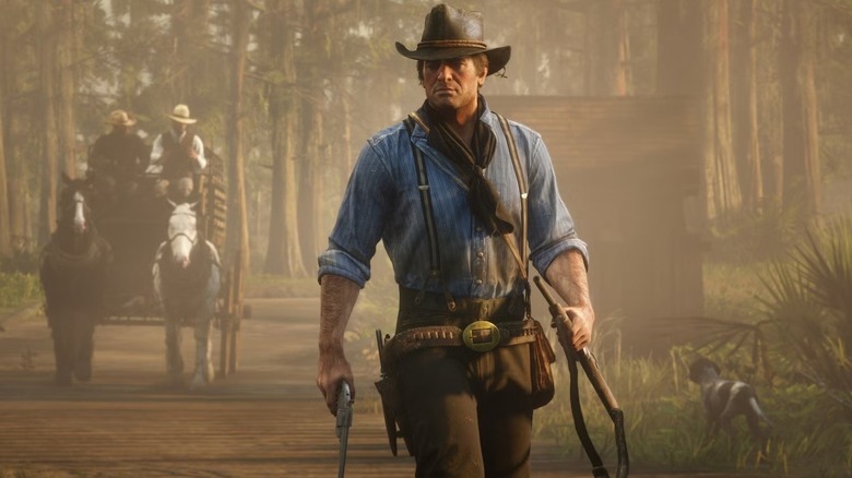 Arthur Morgan pisztolyt és vadászpuskát tart a Red Dead Redemption 2-ben