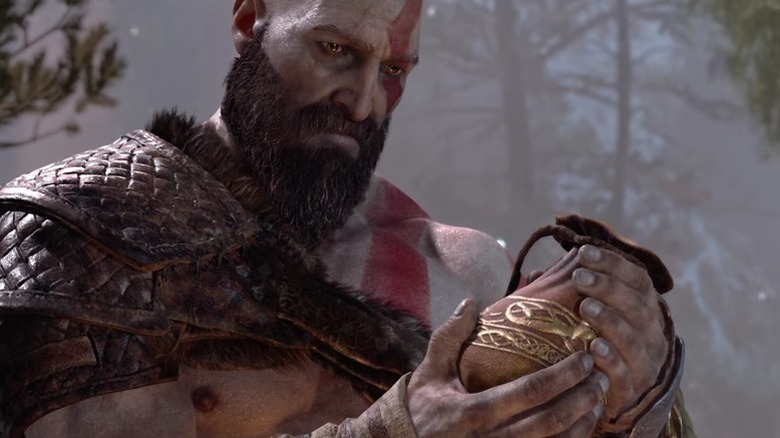 Kratos egy zacskó hamut tart a God of War című filmben (2018)