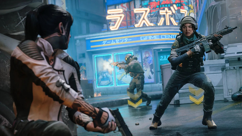Kagan egy katonára pillant, miközben fedezékbe bújik a Call of Duty: Black Ops 7-ben