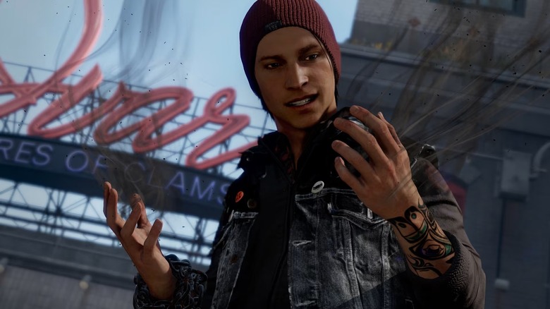 Delsin Rowe füstölgő kezeit vizsgálja az Infamous Second Son című filmben
