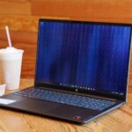 HP OmniBook 3 16 laptop open on a desk showing its keyboard and display