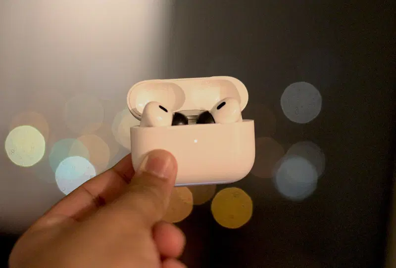Close-up of memory foam ear tips fitted onto a pair of wireless earbuds