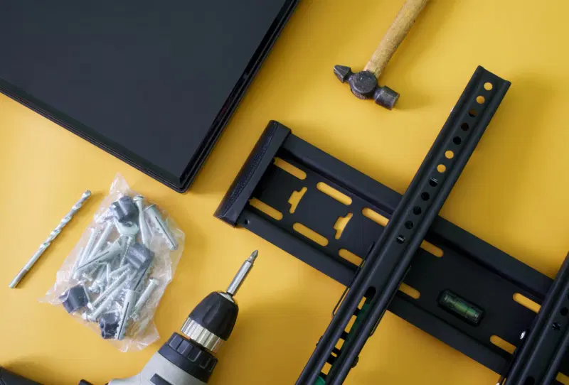 Close-up of a VESA mount bracket attached to the back of a wall-mounted television