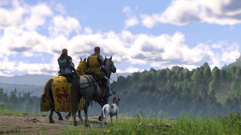 Henry, Hans és kutyáik lovakon lovagolnak egy mezőn a Kingdom Come: Deliverance II-ben