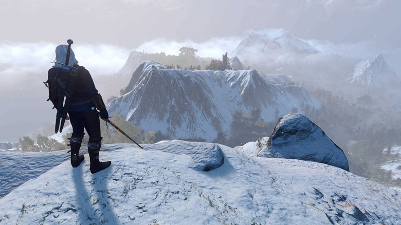 Geralt egy havas hegyen áll a The Witcher 3: Wild Huntban