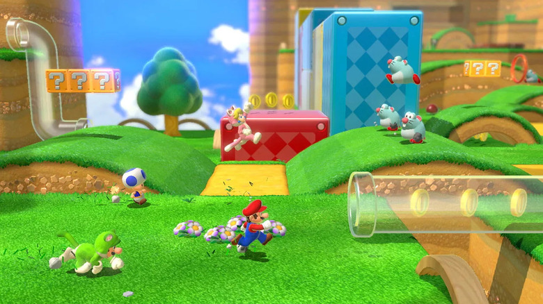 Mario, Peach, Toad és Luigi egy lánccső felé futnak a Super Mario 3D Worldben