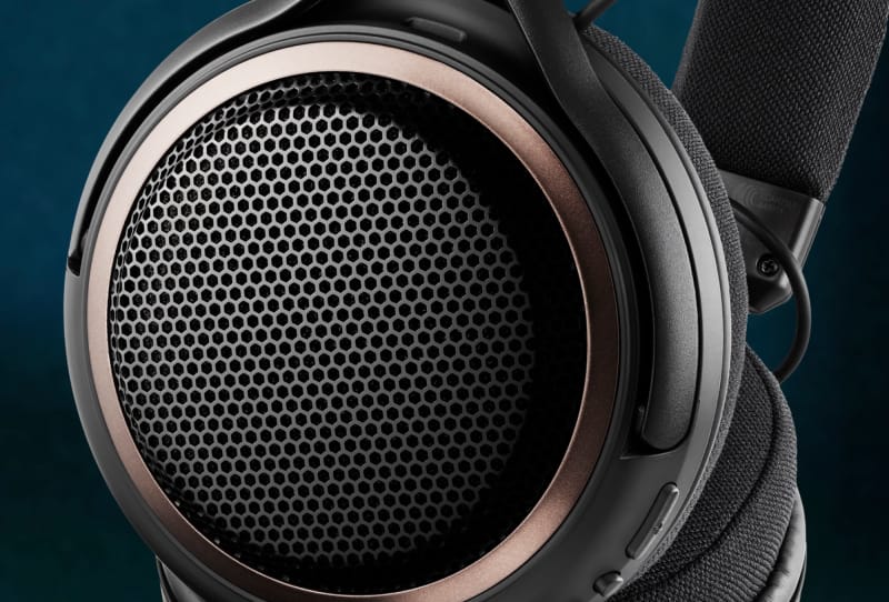 Audio-Technica ATH-AL5NC open-back headphones shown from the side on a stand