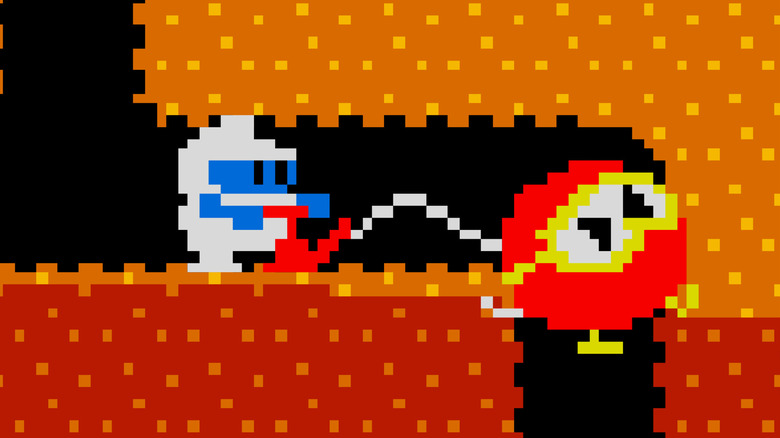 Dig Dug légpumpával felfújja az ellenséget a Dig Dugban
