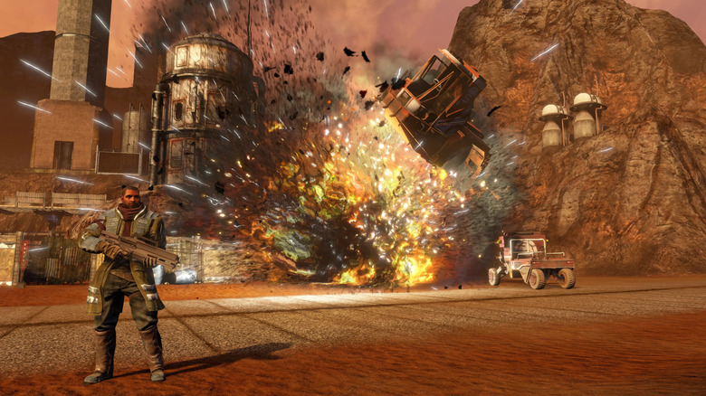 Egy katona áll a Red Faction: Guerrilla felrobbanó bázisa mellett