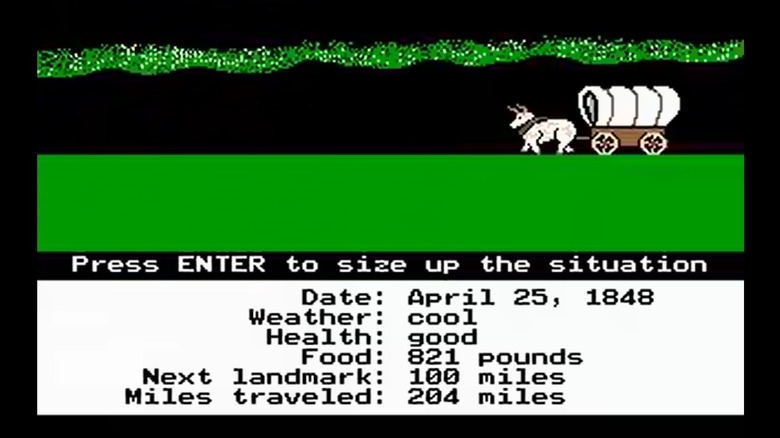Képernyőkép a klasszikus Oregon Trailről, nyugat felé tartó kocsival, alján állapotszöveggel.