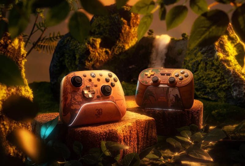 8BitDo Tomb Raider anniversary controllers featuring Lara Croft artwork and Hall-effect triggers