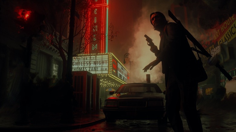 Alan Wake egy sötét utcán vándorol fegyverrel