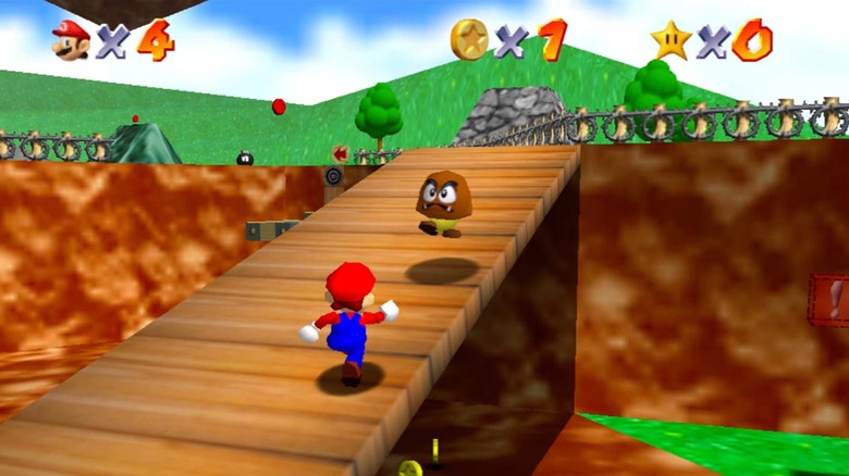 Mario egy fahídon fut fel egy Goomba felé a Super Mario 64-ben