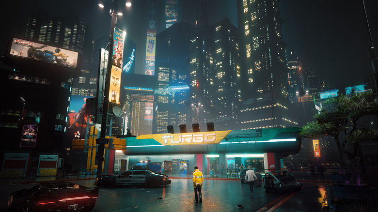 Egy Cyberpunk 2077 játékos a Night City belvárosa előtt