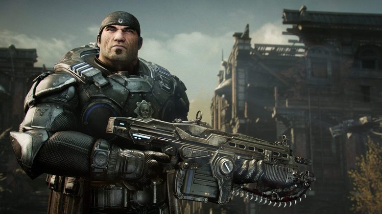 Marcus Fenix ​​egy géppuskát tart a Gears of War: Reloaded játékban