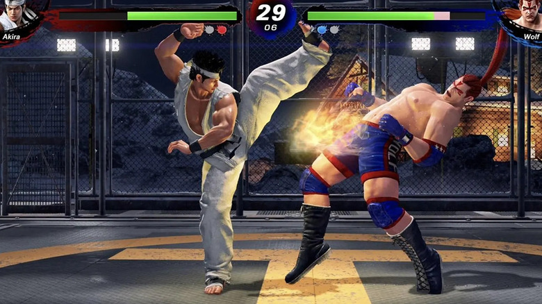 Akira arcon rúgja Wolfot a Virtua Fighter 5 Ultimate Showdownban