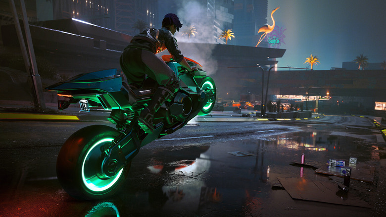 V zölden világító motorkerékpárt vezet a Cyberpunk 2077 utcáin