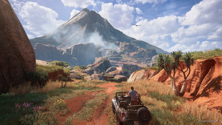 Nathan Drake terepjárót vezet egy vörös agyagos ösvényen