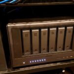 Minisforum S5 NAS fanless chassis showing NVMe drive bays and rear USB4 and 10GbE ports