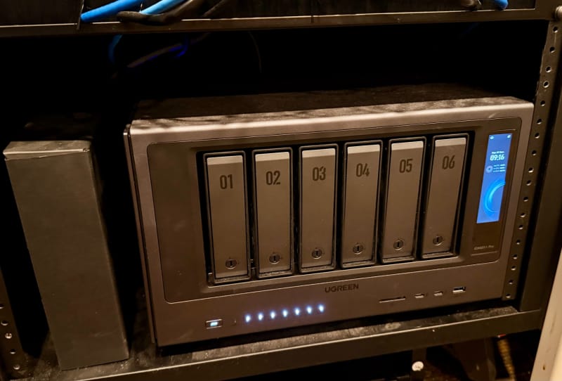 Minisforum S5 NAS fanless chassis showing NVMe drive bays and rear USB4 and 10GbE ports