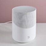 Bluesound speaker displaying the BluOS app with Bluesound Apple Music integration active