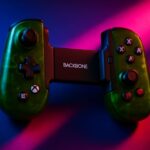 Xbox controller next to a screen streaming a game, representing Xbox Cloud Gaming prepaid plans