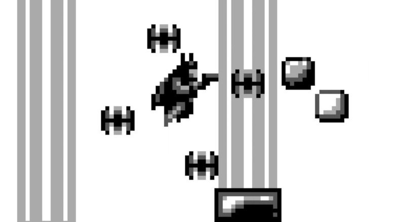 Batman ugrál Batarangokkal körülvéve a Batman: The Video Game-ben