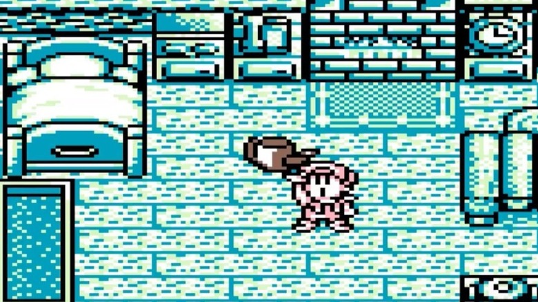 A játékos karakter feltart egy vizeskannát a Harvest Moon GB-ban