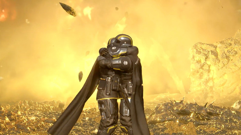 Két játékos ölelkezik a csatatér közepén a Helldivers 2-ben