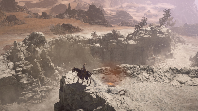 Egy játékos a Diablo 4-ben lovon ül egy száraz völgyben