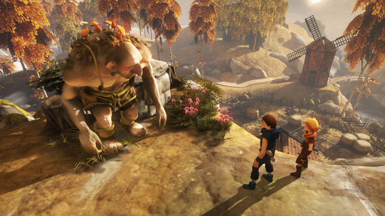 A Brothers: A Tale of Two Sons két szereplője egy óriással beszélget