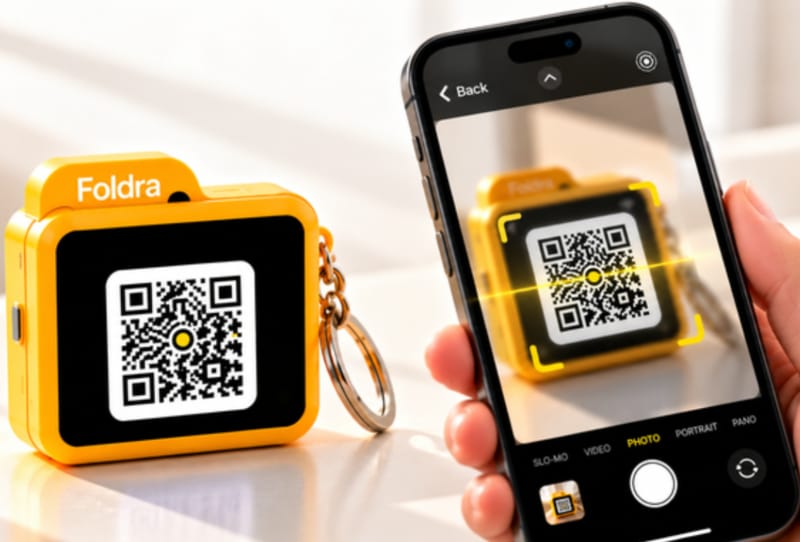 Foldra pocket cloud server shown on a keyring with its small touch OLED screen